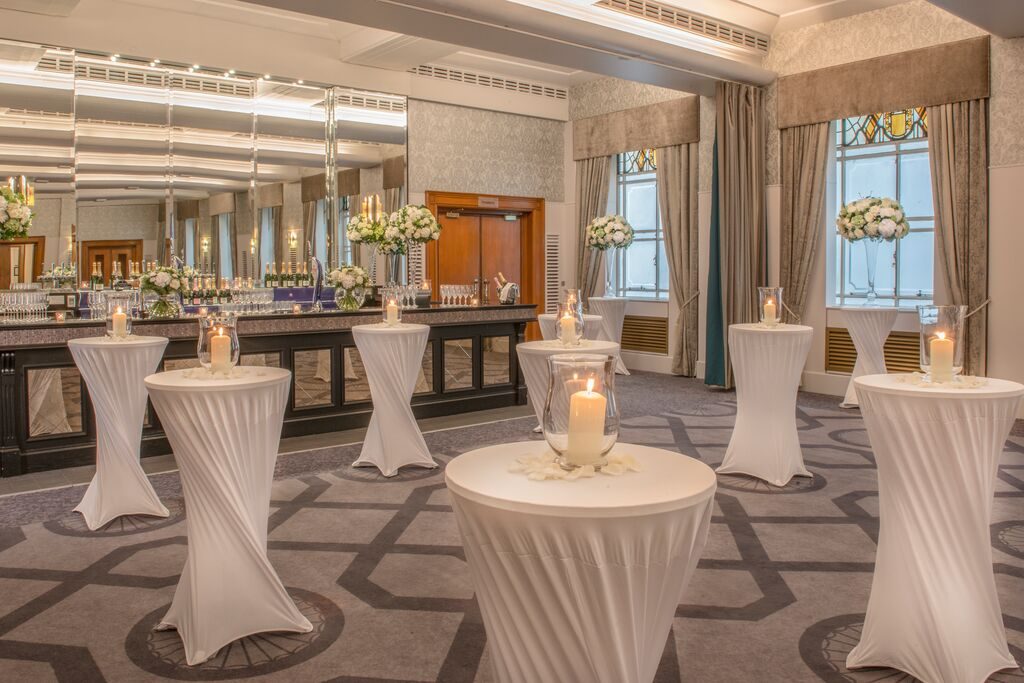 Drinks reception with poseur tables at the Grand Connaught Rooms
