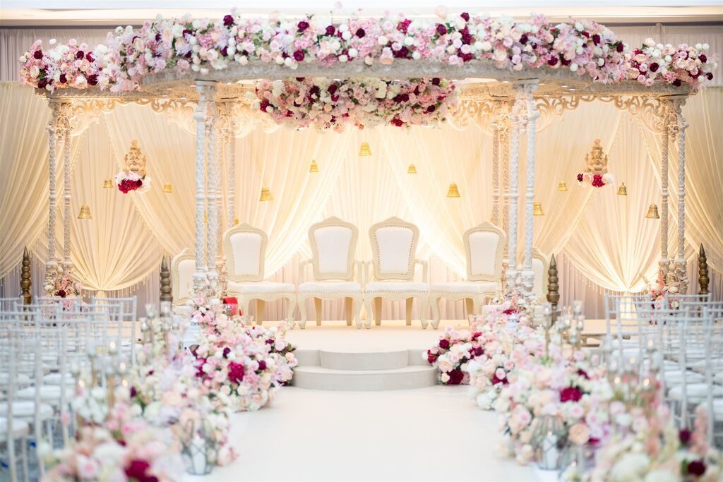 Floral mandap dressed for an Asian wedding ceremony at the Grand Connaught Rooms